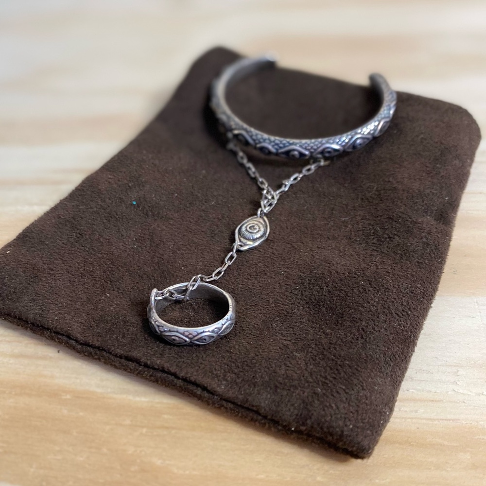 Silver Bracelet With Attached Ring - image 1